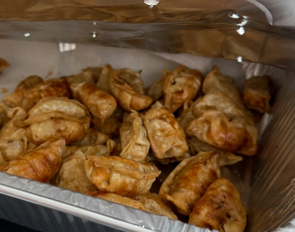 Tray of golden fried potstickers